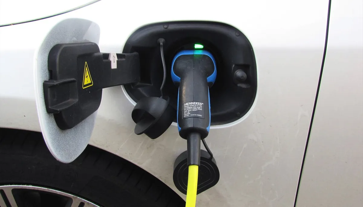 Charging cable connected to an electric vehicle