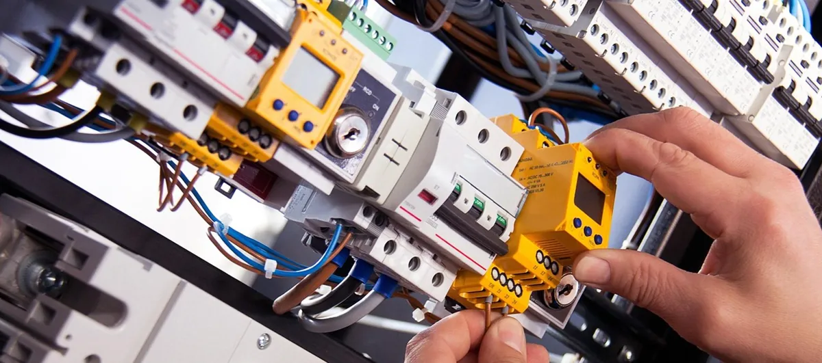 Electrical wiring and control equipment being worked on